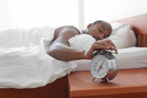 Person hitting snooze button
