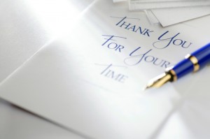 handwritten thank-you note with blue pen
