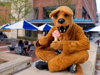 The Nittany Lion enjoys some ice cream at the Berkey Creamery.
