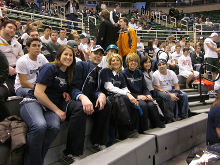 World Campus staff, students, and guests enjoy a night of Penn State basketball at the Breslin Student Events Center on the Michigan State campus. From left to right: guest Lauren Synko, student Kent Grantham, director of academic affairs for undergraduate programs Karen Pollack, academic adviser Donna Anderson, guest Gerica Hale, and student Shea Marks. Photo courtesy of Shubha Kashyap.
