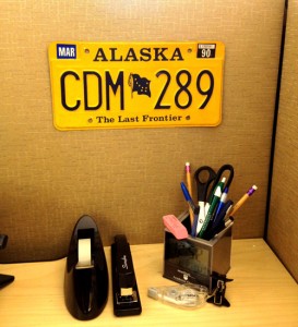 Ashley's Alaska license plate in her office.
