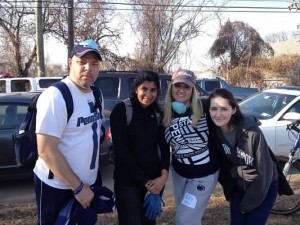 Me (right-center), my husband Dion (left), and two other volunteers assist in Staten Island.
