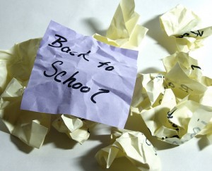 Crumpled papers with "back to school" written on post-it note