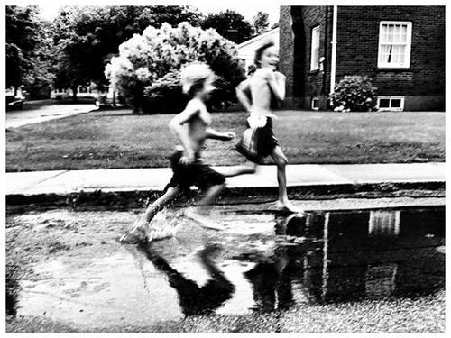 Children running in water