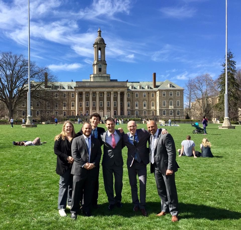 Jason Lin with fellow Penn State World Campus students in front of Old Main.